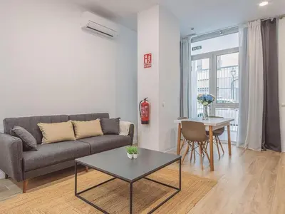 a living room with a couch and a table at Winahost Apartamento Benimaclet 1 in Valencia