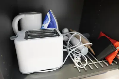 a white toaster sitting on top of a refrigerator at Céntrico & Lujoso in Valencia