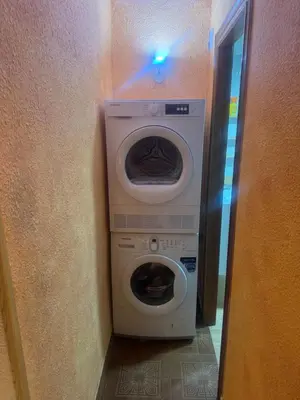 a washer and dryer in a hallway of a room at Apartamento en el faro de Cullera in Cullera