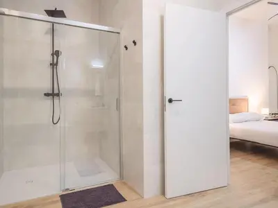 a bathroom with a shower with a glass door at Central Apartment in Benimaclet 2 in Valencia