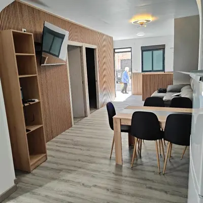 a conference room with a table and chairs at Piso A playa 19 in Puerto de Sagunto