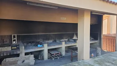 a building that is being remodeled with a table at Casa Rural Torás Piscina, BBQ, Chimenea y WiFi 600Mb in Torás