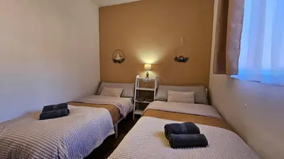 a room with three beds in a room at Casa Rural Torás Piscina, BBQ, Chimenea y WiFi 600Mb in Torás