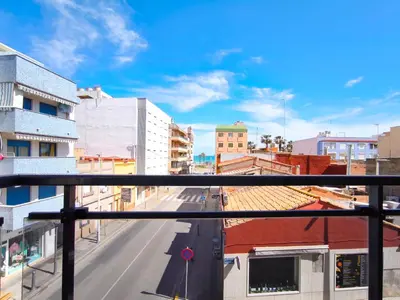 a view of a city street from a balcony at Apartamento con terraza en Playa Grau de Moncofa in Moncófar
