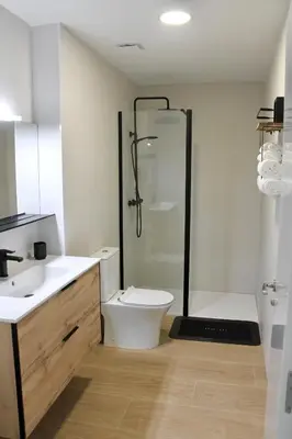 a bathroom with a shower and a toilet and a sink at Maresia Zarco in Valencia