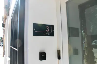 a door with a clock on the side of it at Maresia Zarco in Valencia