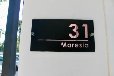 a sign on a wall with the number marssein at Maresia Zarco in Valencia