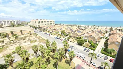 a view of a city with palm trees and the ocean at BEACH VALENCIA LUXURY D9-28 Apartment with terrace and sea views with two rooms in Valencia