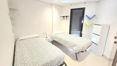 a hospital room with two beds and a window at BEACH VALENCIA LUXURY D9-28 Apartment with terrace and sea views with two rooms in Valencia