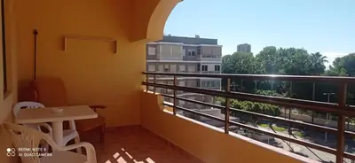 a balcony with a table and a view at Apartamento Cullera Playa in Cullera