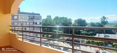 a balcony with a view of a parking lot at Apartamento Cullera Playa in Cullera