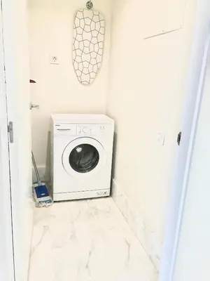 a laundry room with a washer and dryer at Panoramic Suites II By VALENCIAFLATS EU in Valencia