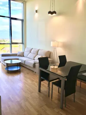 a living room with a couch and a table at Panoramic Suites II By VALENCIAFLATS EU in Valencia