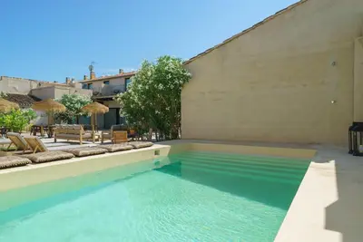 a swimming pool in the middle of a building at Alqueria de Vilches in Cullera