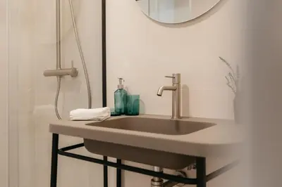 a bathroom with a sink and a shower at Doce de Colón Requena in Requena