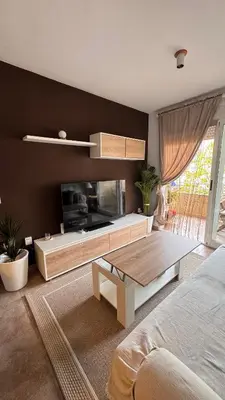 a bedroom with a living room with a tv and a table at Apartamento en Canet De Berenguer Playa - Valencia in Valencia