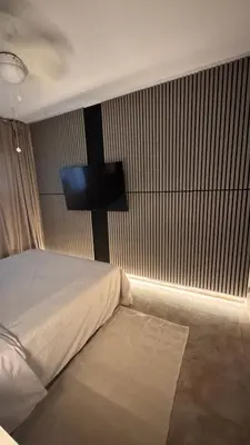 a bedroom with a bed with a television on the wall at Apartamento en Canet De Berenguer Playa - Valencia in Valencia