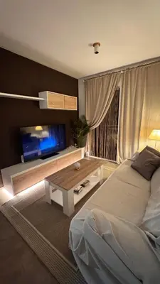 a bedroom with a bed and a tv and a table at Apartamento en Canet De Berenguer Playa - Valencia in Valencia
