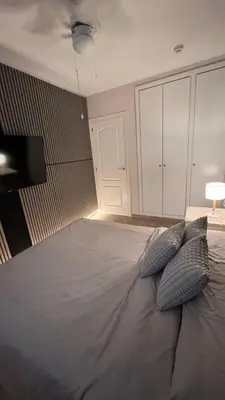 a bedroom with a large bed with two pillows on it at Apartamento en Canet De Berenguer Playa - Valencia in Valencia