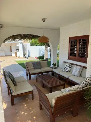 a living room with a couch and a fireplace at Villa 20min Valencia - Playas in San Antonio de Banageber
