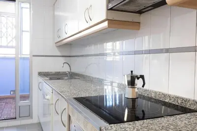 a kitchen with a coffee maker on a counter at Beachside Apartment Valencia Ideal for Digital Nomads in Valencia
