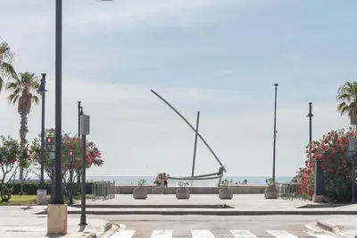 a large sculpture of a fish on the beach at Beachside Apartment Valencia Ideal for Digital Nomads in Valencia