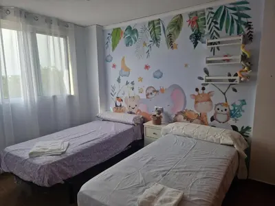 two twin beds in a room with two beds sidx sidx sidx at Calma mediterránea in Favareta