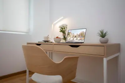 a desk with a laptop and a chair on it at SingularStays Plaza Andújar in Valencia