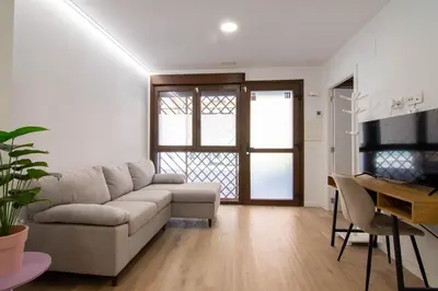 a living room with a couch and a table at Casa Pedro Cabanes in Valencia