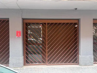 a building with a door with a metal gate at Casa Pedro Cabanes in Valencia