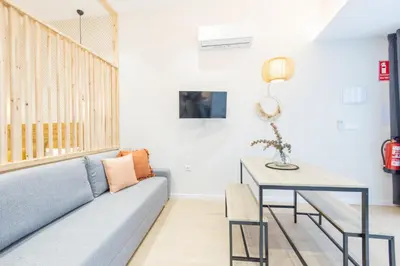 a living room with a couch and a table at Marina Arts Lofts in Valencia