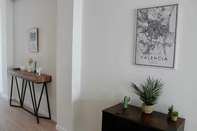 a room with a table and a picture on the wall at Arenisca Zarco in Valencia