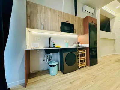 a kitchen with a counter and a sink in a room at Modern Apartment with Style near Center in Valencia