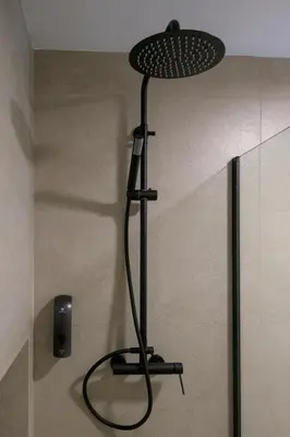 a black lamp sitting on the corner of a room at Céntrico 4 personas Ciudad Ciencias in Valencia
