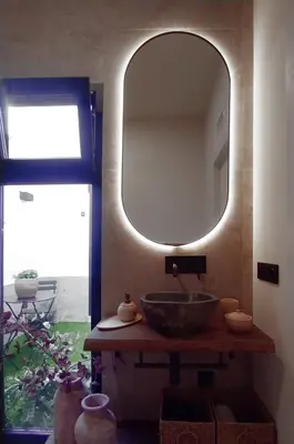 a bathroom with a sink and a mirror at The Robby's home in Valencia