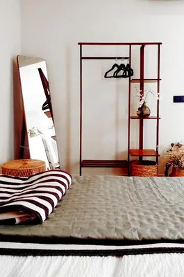 a bed in a room with a mirror and a bed sidx sidx sidx at The Robby's home in Valencia