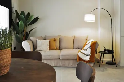 a living room with a couch and a table at The Robby's home in Valencia