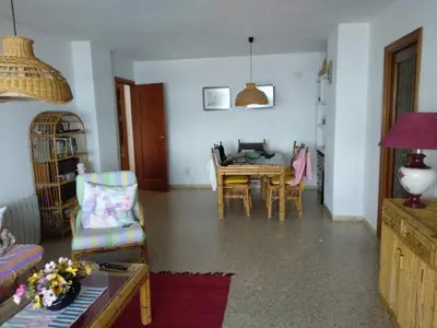 a living room with a table and chairs at barlovento in Sueca