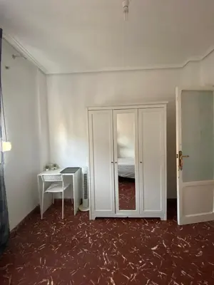 a room with a white cabinet and a bed at Rincón Valenciano - Campanar in Valencia