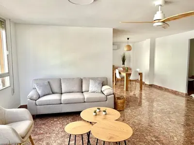 a living room with a couch and a table at El sitio de Ana in Burriana
