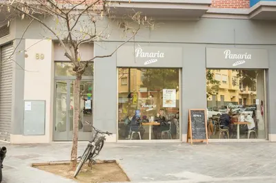 a bike parked in front of a restaurant at ATTIC ROOMs VALENCIA in Valencia
