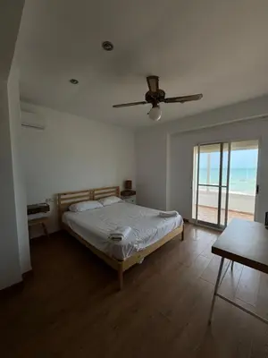 a bedroom with a bed and a ceiling fan at El Encanto del Perelló in Sueca