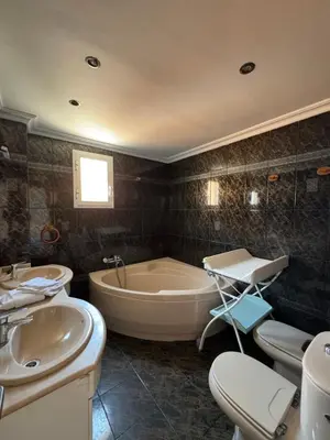 a bathroom with a tub and a toilet and a sink at El Encanto del Perelló in Sueca