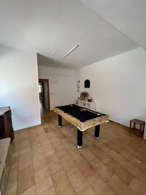 a room with a ping pong table in it at El Encanto del Perelló in Sueca