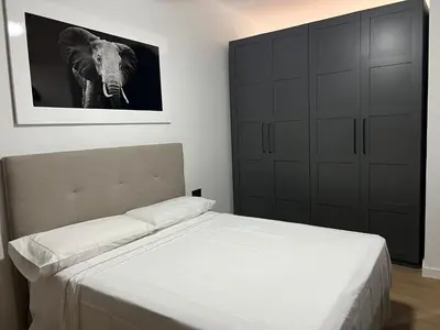 a bedroom with a bed and a picture of an elephant at Turia Loft Valencia in Valencia