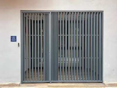 a metal gate on the side of a building at Turia Loft Valencia in Valencia