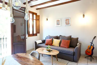 a living room with a couch and a table at Dramaturgo Faust Hernandez Prime in Valencia