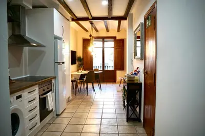 a kitchen with a tile floor and a dining room at Dramaturgo Faust Hernandez Prime in Valencia