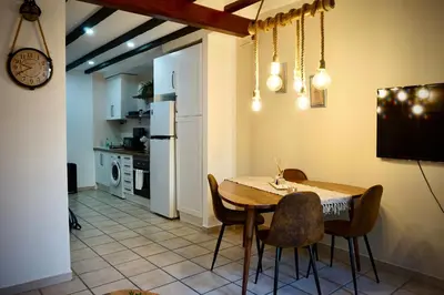 a kitchen and dining room with a table and chairs at Dramaturgo Faust Hernandez Prime in Valencia