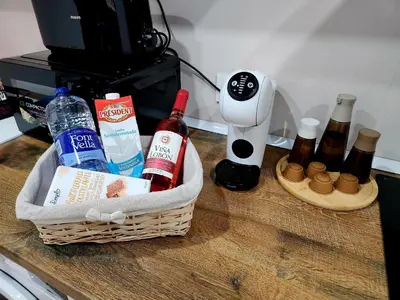 a basket with bottles of alcohol on a counter at Dramaturgo Faust Hernandez Prime in Valencia